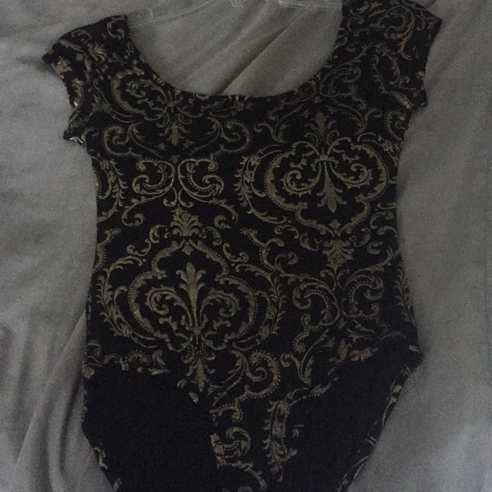 Black and gold body suit